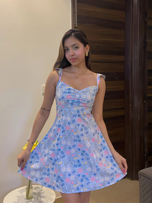 A short blue Summer floral dress, a front pose.