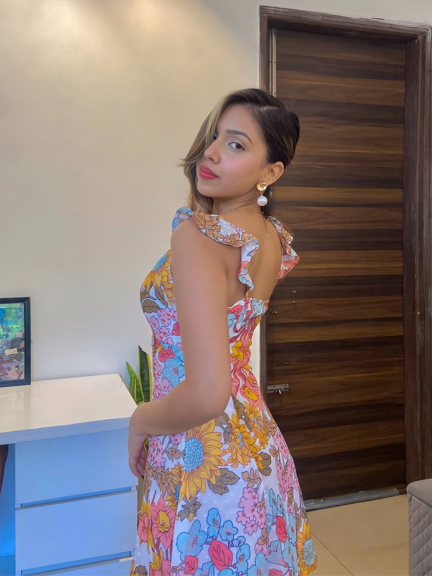A short  Summer floral dress, a side pose